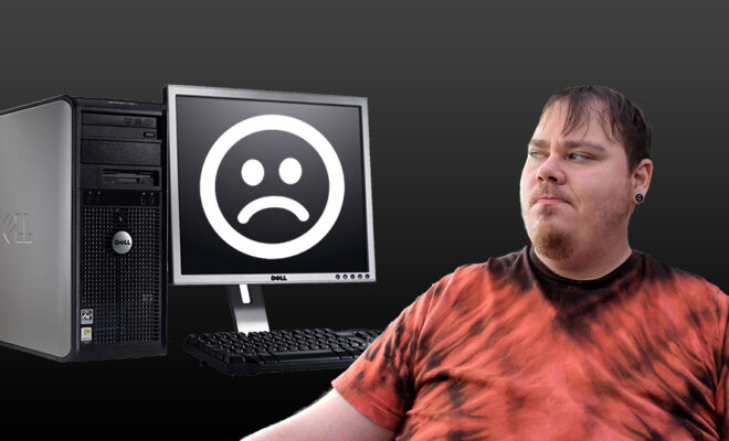 Looking Disappointed at a Dell Desktop